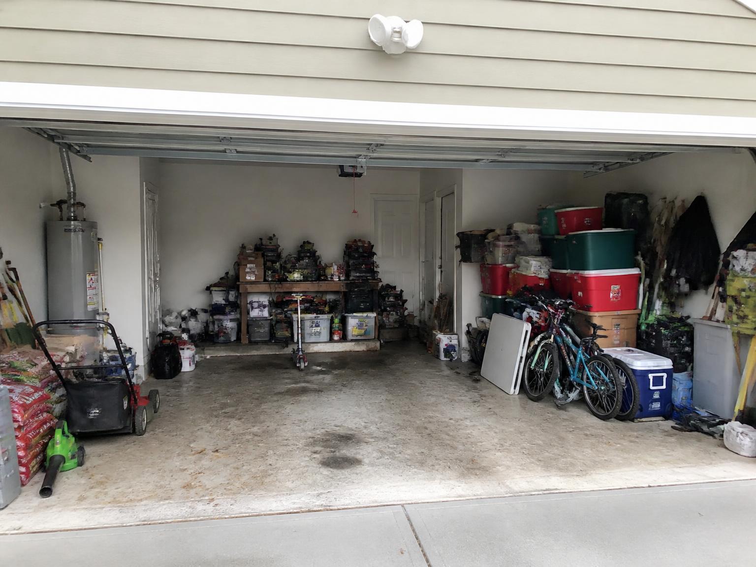 Garage cleanout and organization in North Raleigh · Two-car garage — before and after — before