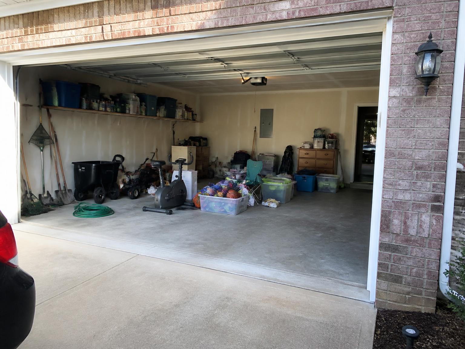 Garage cleanout and organization in Wake Forest · Three-car garage — before and after — before