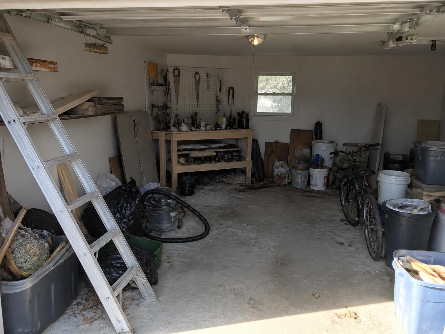 Garage cleanout and organization in Raleigh · Single-car garage + workshop — before and after — before