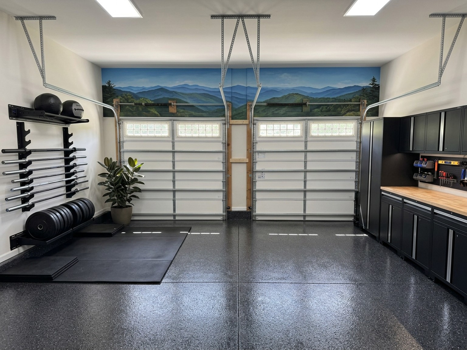 Garage gym conversion in Wake Forest — messy garage before and epoxy floor, mural, and gym zone after — after