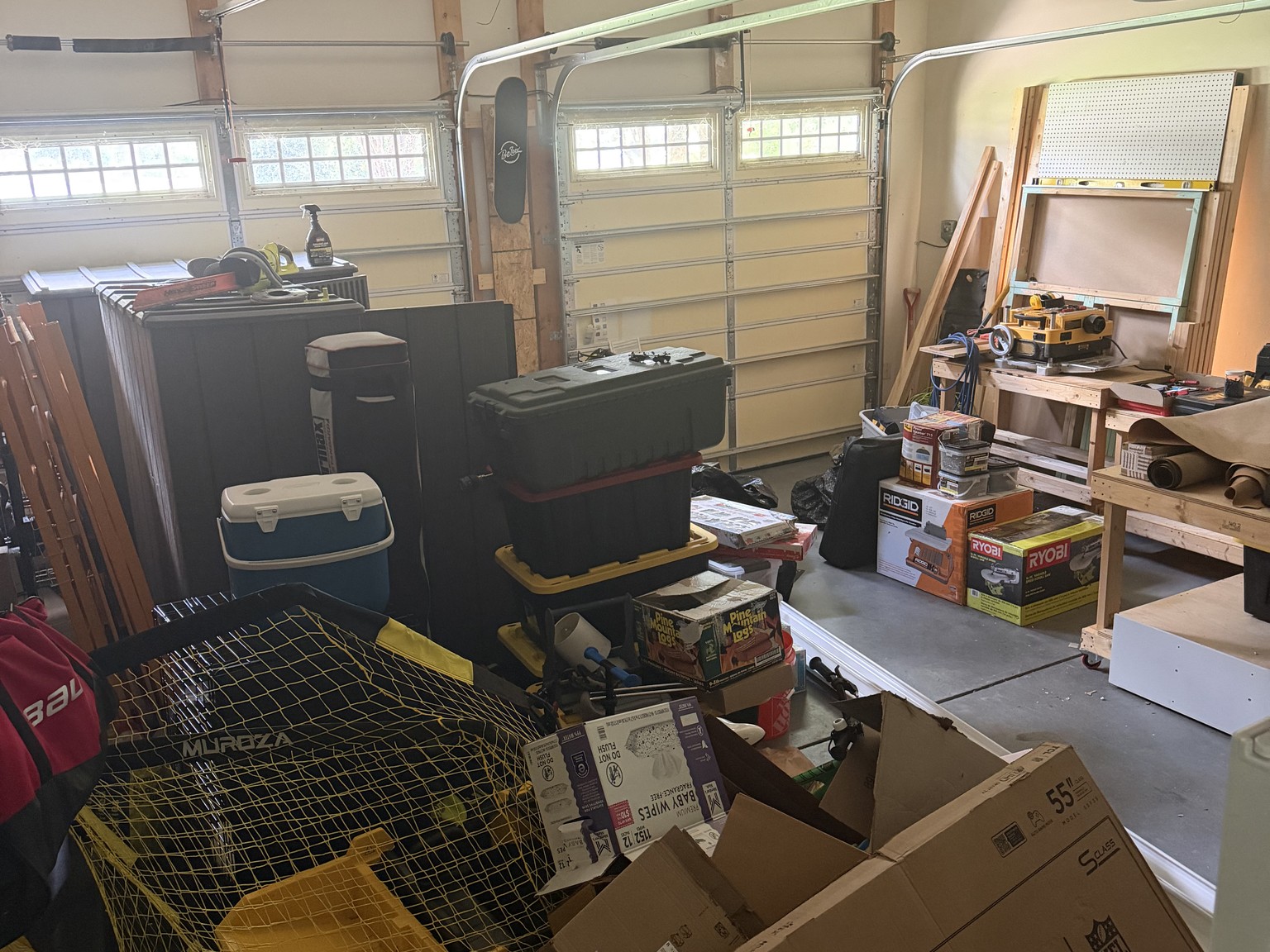 Garage gym conversion in Wake Forest — messy garage before and epoxy floor, mural, and gym zone after — before